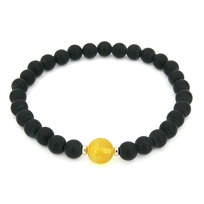 Bransoletka z kulką bursztynową i czarnym matowym onyksem 8695