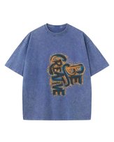 Damska koszulka oversize efekt sprania Bądź Kreatywny Rozwój Niebieska S