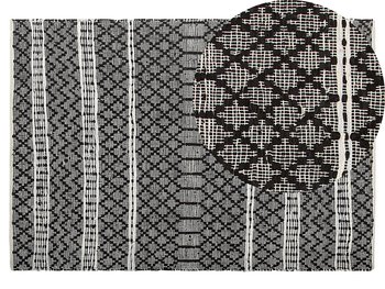 Dywan skórzany BELIANI Fehimli, czarny, 140x200 cm - Beliani
