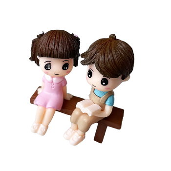 Figurki Dziewczynka w różowej sukience i chłopiec na ławce z książką - HABARRI