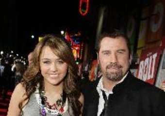 Piorunująca Miley z Travoltą i pies w komputerze