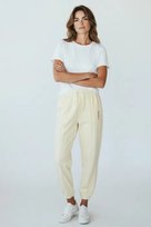 Nike Spodnie damskie Sportswear Loose Fit kremowe Nike