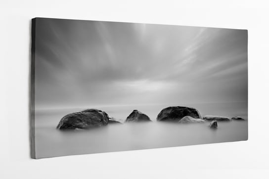 Obraz na płótnie HOMEPRINT, kamienie w morzu, szare niebo, chmury 100x50 cm HOMEPRINT