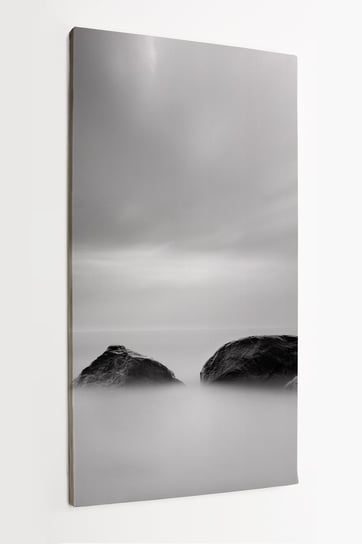 Obraz na płótnie HOMEPRINT, kamienie w morzu, szare niebo, chmury 60x120 cm HOMEPRINT