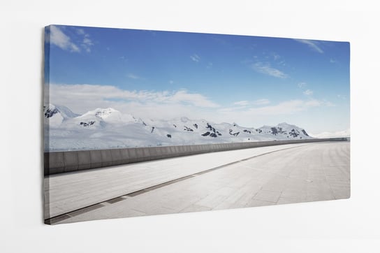 Obraz na płótnie HOMEPRINT, pusta droga, góry pokryte śniegiem, krajobraz zima 120x50 cm HOMEPRINT