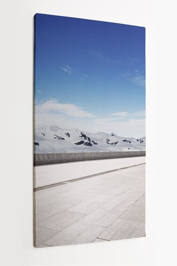 Obraz na płótnie HOMEPRINT, pusta droga, góry pokryte śniegiem, krajobraz zima 50x100 cm HOMEPRINT