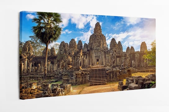 Obraz na płótnie HOMEPRINT, starożytne kamienne twarze, zachód słońca, świątynia Bayon, Angkor Wat, Siam 100x50 cm HOMEPRINT