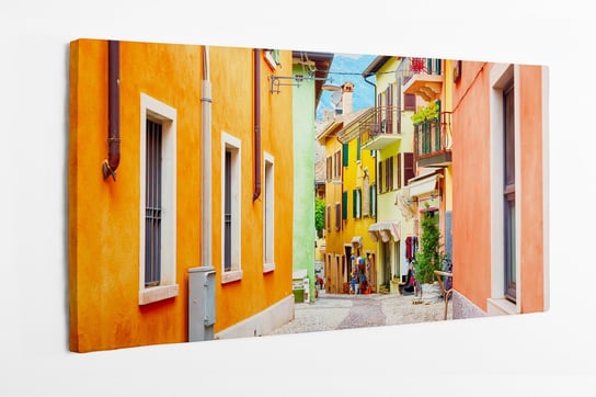 Obraz na płótnie HOMEPRINT, wąska uliczka, kolorowe domy, architektura, Włochy 140x70 cm HOMEPRINT