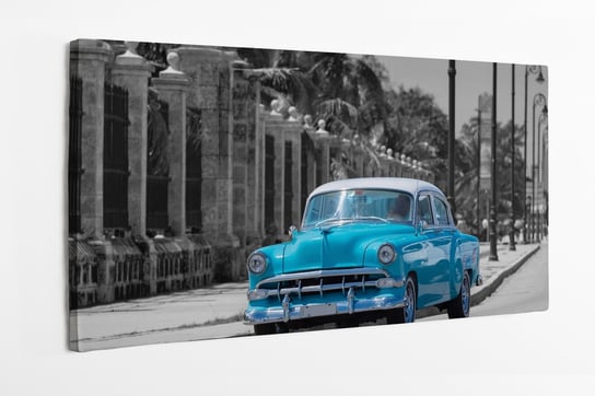 Obraz na płótnie HOMEPRINT, zabytkowy samochód jeździ po słynnym deptaku Malecon w Hawanie 120x50 cm HOMEPRINT