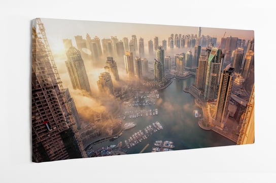 Obraz na płótnie HOMEPRINT, zachód słońca, wieżowce, chmury, widok z góry, Dubaj, Zjednoczone Emiraty Arabskie 100x50 cm HOMEPRINT