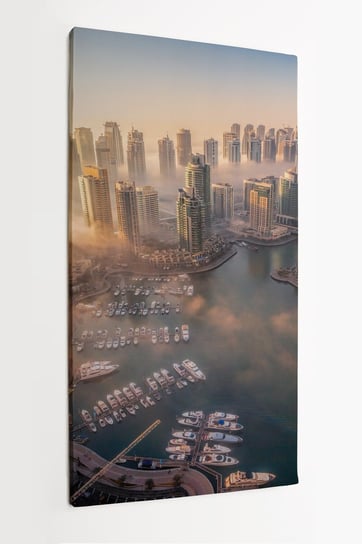 Obraz na płótnie HOMEPRINT, zachód słońca, wieżowce, chmury, widok z góry, Dubaj, Zjednoczone Emiraty Arabskie 50x100 cm HOMEPRINT