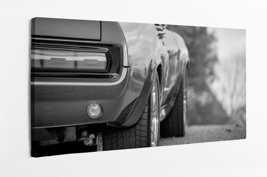 Obraz na płótnie HOMEPRINT, zbliżenie na klasyczny samochód typu Mustang 120x60 cm HOMEPRINT